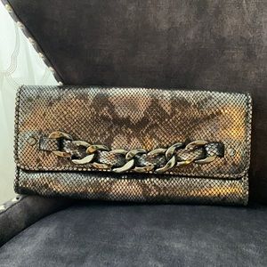 Faux snake skin clutch